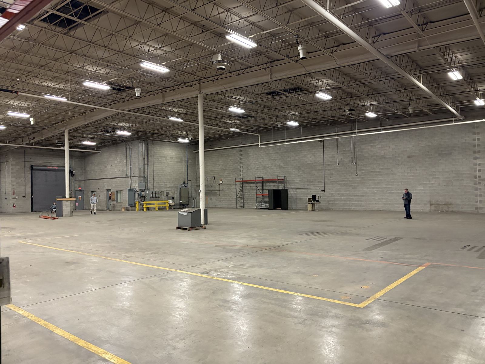 Open warehouse floor with team